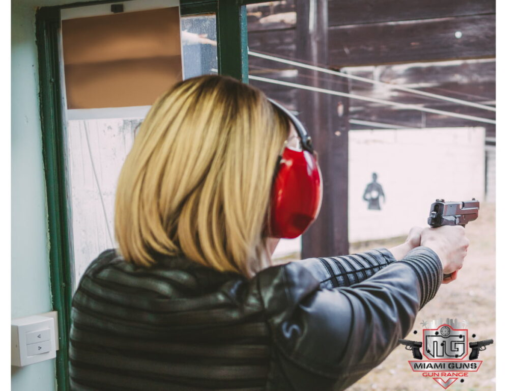 Woman wearing headphones at gun range 